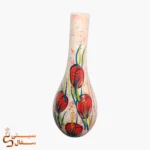 گلدان تک شاخه نارنجی مدل آوا سرامیکی با گل‌های نارنجی روی زمینه‌ی کرم